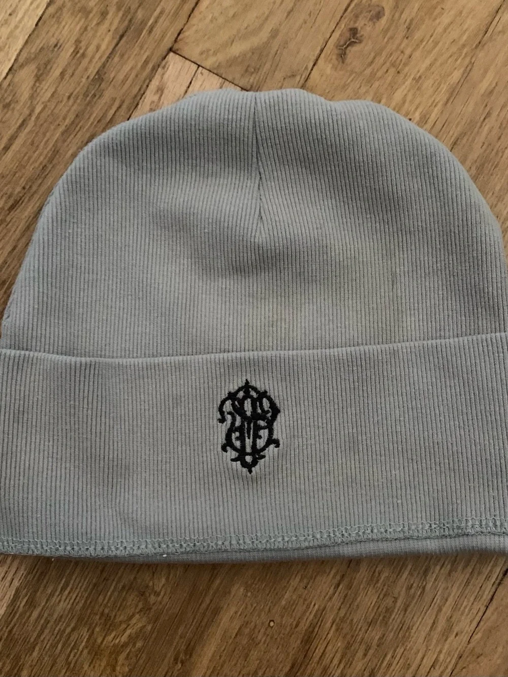 Light Gray Knit Beanie with Black Embroidered Emblem